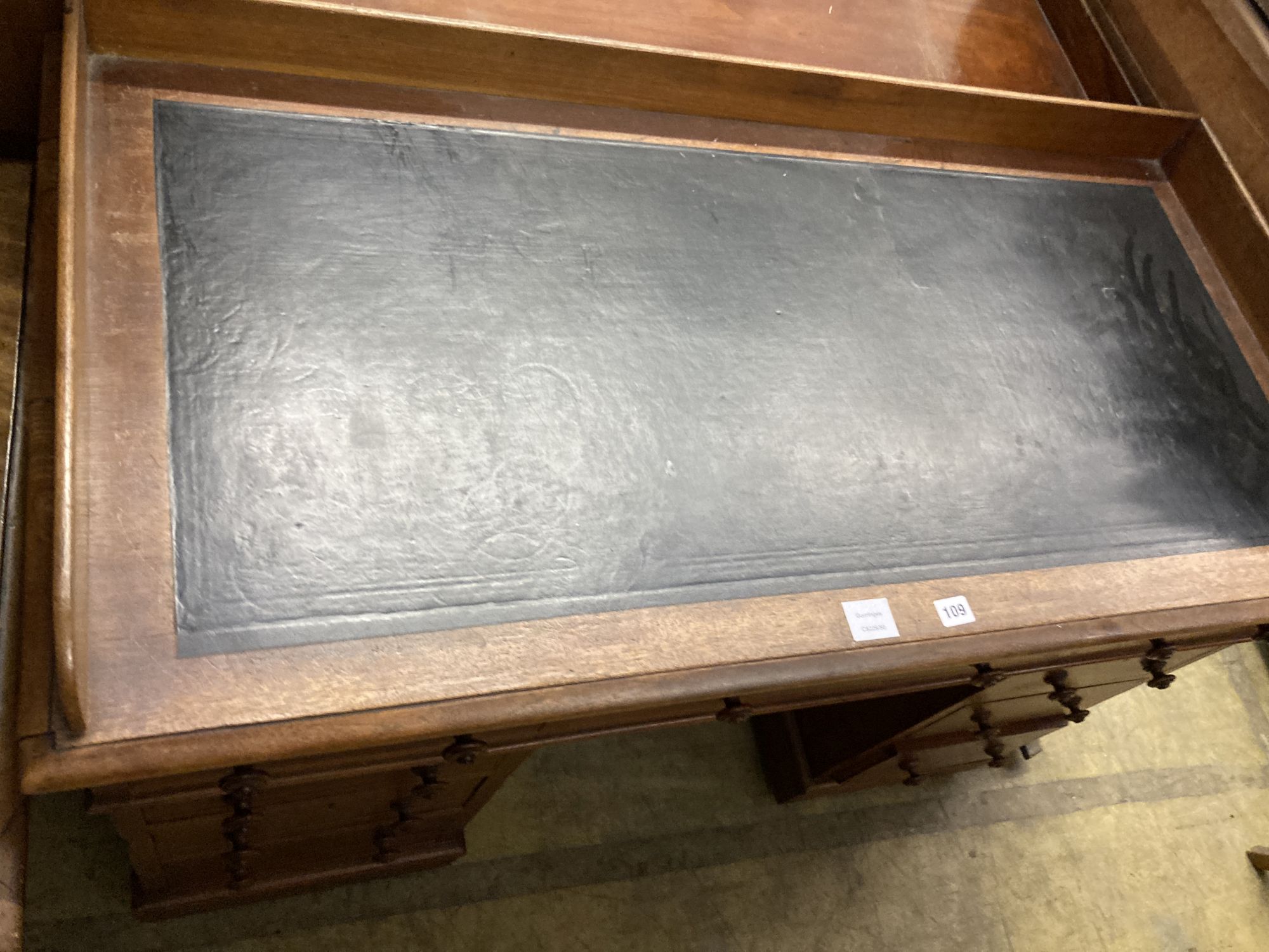 A Victorian mahogany pedestal desk, with a three quarter gallery top, width 122cm, depth 60cm, height 83cm